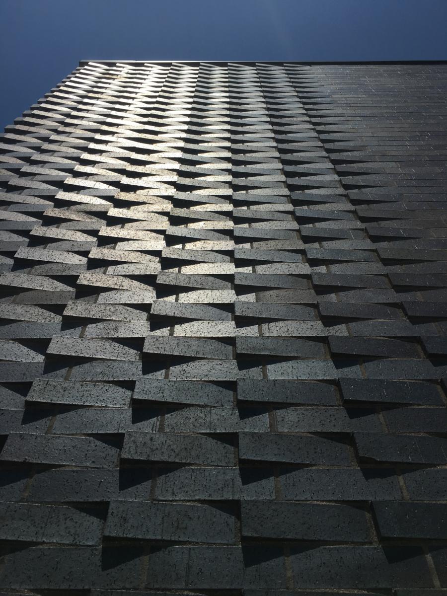 With a tree before it, the dark brick wall of the Bruce D. Nesbitt African American Cultural Center stand tall